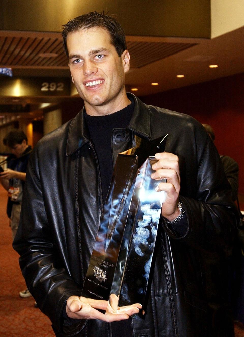 Holding the Most Valuable Player award for Super Bowl XXVI in February 2002 in New Orleans.