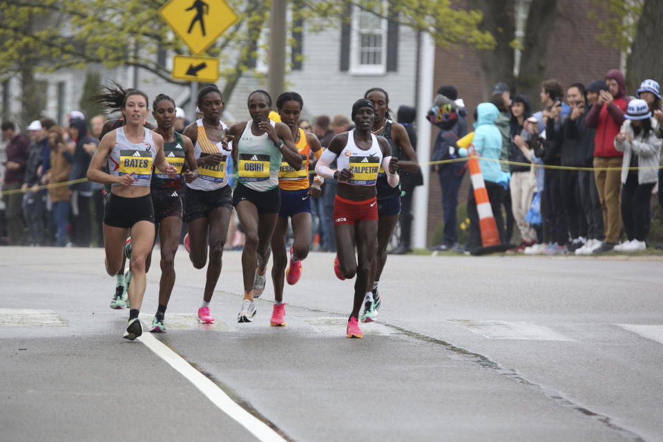 The lead pack of runners in the women’s division, including Hellen Obiri, center, compete in the 127th Boston Marathon in Newton, Mass., Monday, April 17, 2023. (AP Photo/Jennifer McDermott)