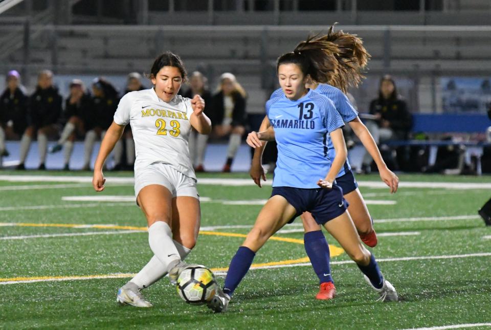 Moorpark's Zaina Barakat, left, and Camarillo's Courtney Hogan battle for possession of the ball during a Coastal Canyon League finale. Moorpark won 2-1 in overtime to clinch the league title.