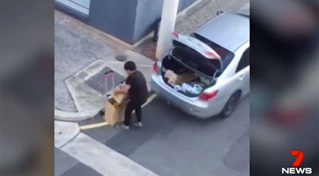 A man seen unloading boxes of formula from his car. Photo: 7 News