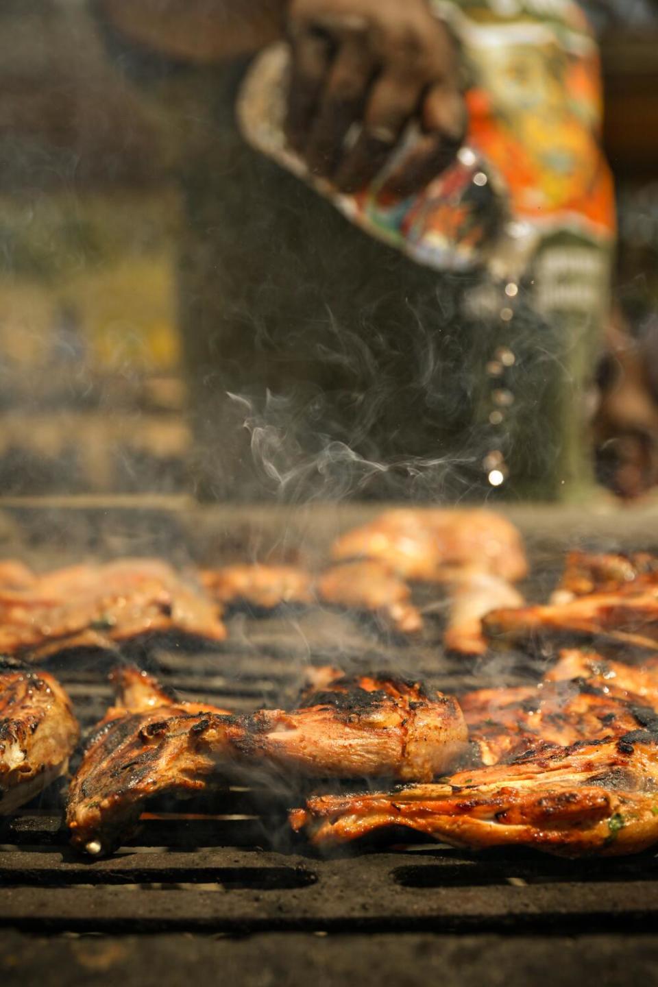 Pieces of chicken on a grill