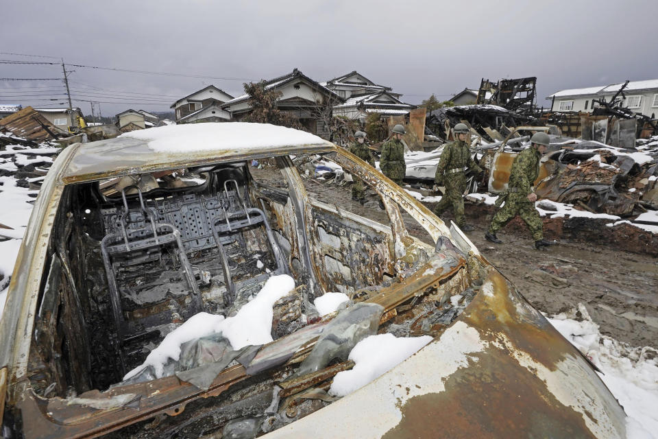 Members of the Japan Self-Defense Forces prepare to conduct a search operation in Suzu, Ishikawa prefecture, Japan Tuesday, Jan. 9, 2024. Thousands of people made homeless by a powerful earthquake on the western coast of Japan were coping with weariness and uncertainty a week after the temblor. (Kyodo News via AP)