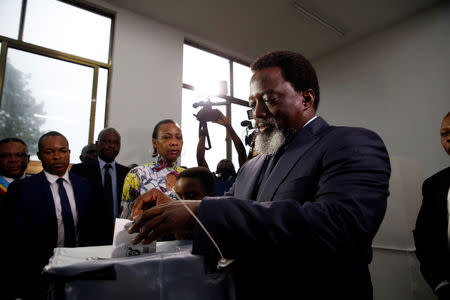 FILE PHOTO: Democratic Republic of Congo's President Joseph Kabila casts his vote at a polling station in Kinshasa, Democratic Republic of Congo, December 30, 2018. REUTERS/Baz Ratner