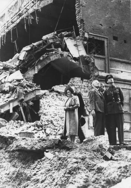 Britain's King George VI and his wife, Queen Elizabeth, view damage at the cinema attached to Madame Tussaud's on September 19, 1940, during one of their tours of London areas affected by the German bombings. UPI File Photo