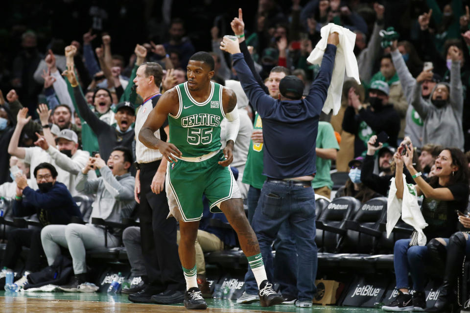 FILE - Fans cheer Boston Celtics' Joe Johnson after he made a shot against the Cleveland Cavaliers during the second half of an NBA basketball game, Wednesday, Dec. 22, 2021, in Boston. It could be argued the untold MVP's of this season were the more than 100 players signed to short-term hardship contracts to fill in when almost every team was decimated by the Omicron variant and other virus issues in December and January. (AP Photo/Winslow Townson, File)