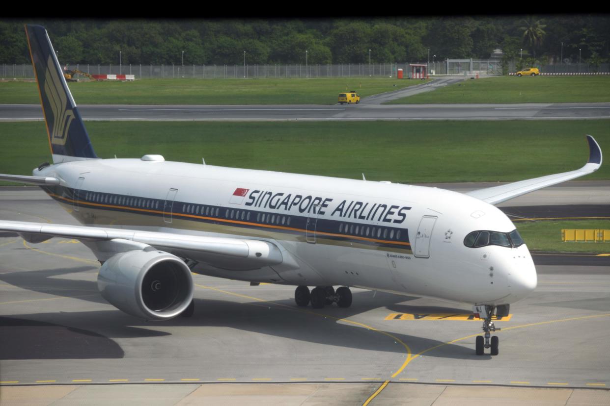 A Singapore Airlines passenger jet taxis along the tarmac as it arrives at Changi International Airport terminal in Singapore on June 8, 2020, as Singapore prepares to reopen its borders after shutting them to curb the spread of the COVID-19 novel coronavirus. (Photo by Roslan RAHMAN / AFP) (Photo by ROSLAN RAHMAN/AFP via Getty Images)