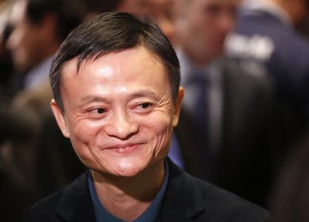 Alibaba Group Holding Ltd founder Jack Ma reacts at the New York Stock Exchange before his company's initial public offering (IPO) under the ticker "BABA" in New York September 19, 2014. REUTERS/Lucas Jackson