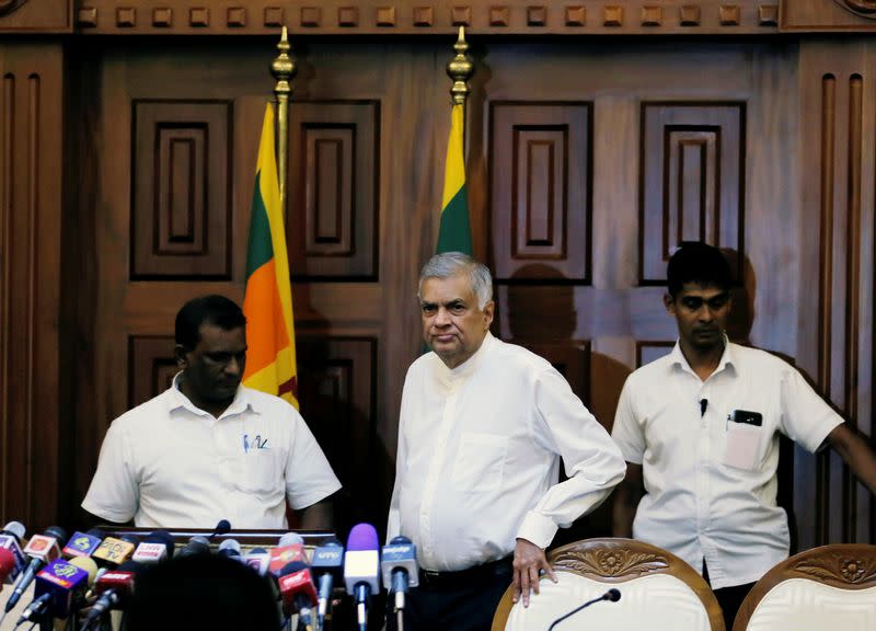 Sri Lanka's ousted Prime Minister Ranil Wickremesinghe arrives at a news conference in Colombo