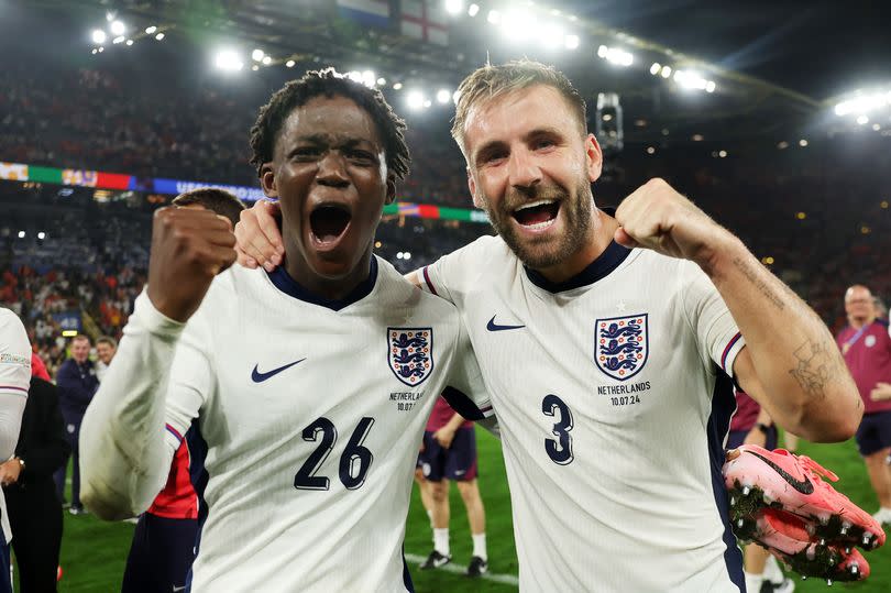 Kobbie Mainoo of England celebrates victory with teammate Luke Shaw after the UEFA EURO 2024 semi-final match between Netherlands and England at Football Stadium Dortmund on July 10, 2024 in Dortmund, Germany.