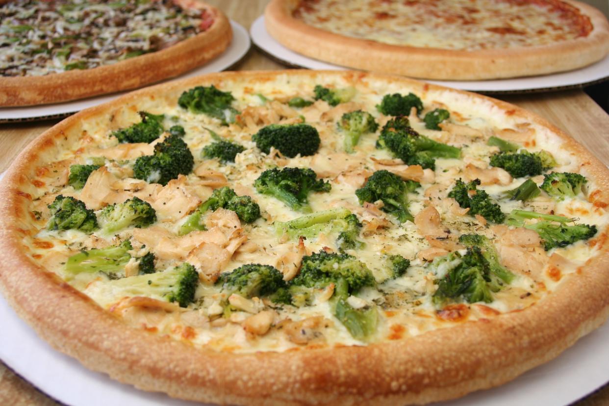 Featuring a white pizza with chicken & broccoli