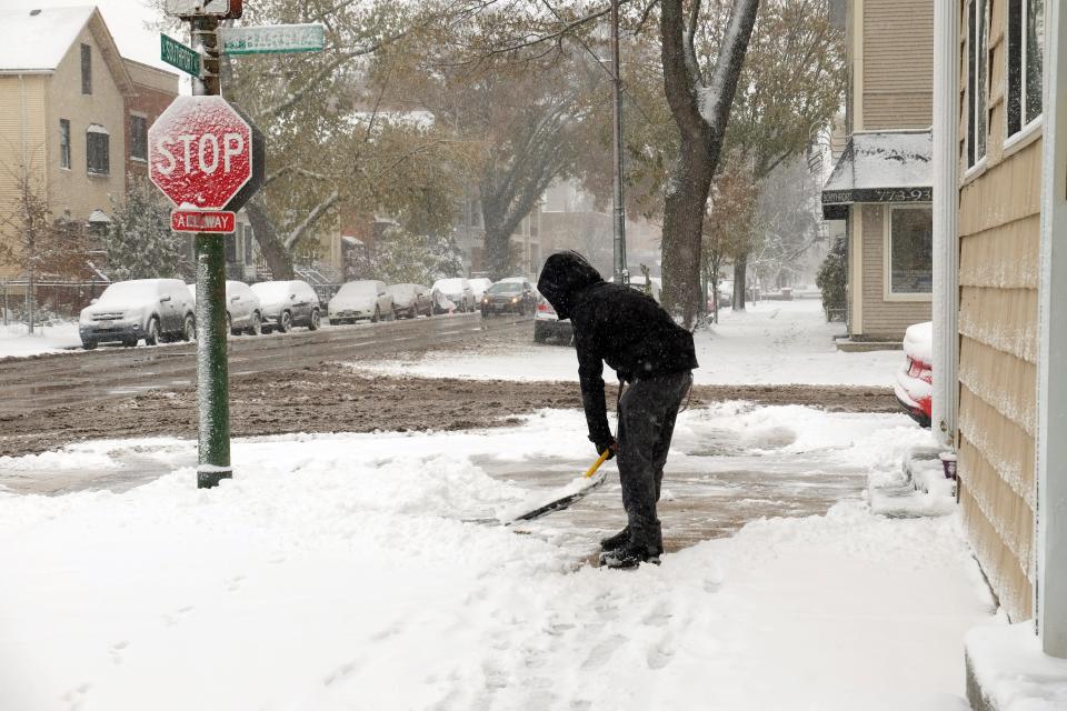 A man shovels snow in Chicago on Nov. 11, 2019.