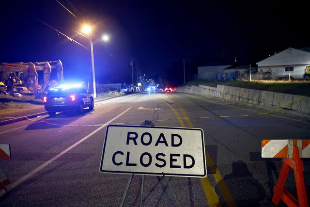 <p>CJ GUNTHER/EPA-EFE/Shutterstock</p> A police car drives toward Schemengees Bar & Grille