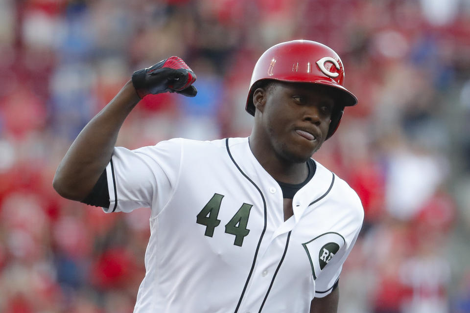 Cincinnati Reds' Aristides Aquino runs the bases after hitting a two-run home run off Chicago Cubs starting pitcher Yu Darvish in the second inning of a baseball game, Friday, Aug. 9, 2019, in Cincinnati. (AP Photo/John Minchillo)