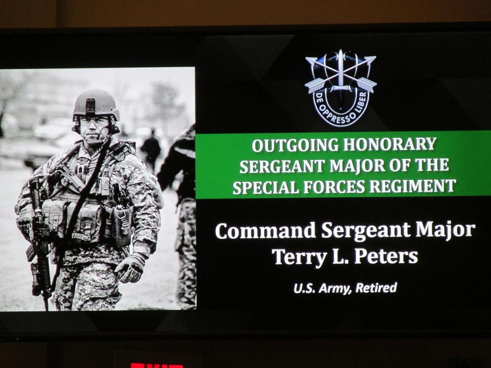 Retired Command Sgt. Maj. Terry Peters is recognized as the outgoing honorary sergeant major of the special forces regiment during a Nov. 4, 2021, ceremony at Fort Bragg.