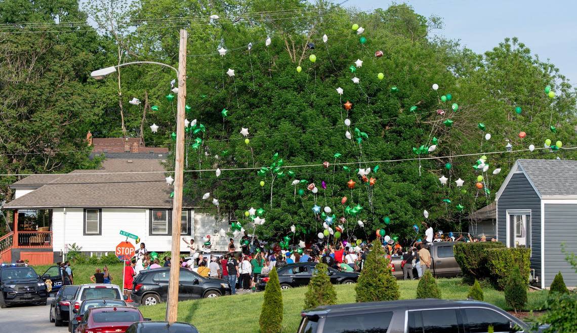 People release balloons during a vigil for 6-year-old Sir’Antonio Brown on Wednesday, May 10, 2023, in Kansas City, Kan. Brown was killed May 3 while playing outside his home.