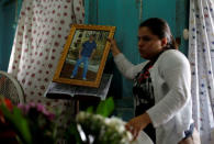 A relative holds a picture of Darwin Manuel Urbina, 29, who according to nation's Red Cross was shot dead during a protest over a controversial reform to the pension plans of the Nicaraguan Social Security Institute (INSS), during his funeral in his home in Managua, Nicaragua April 21, 2018. REUTERS/Jorge Cabrera