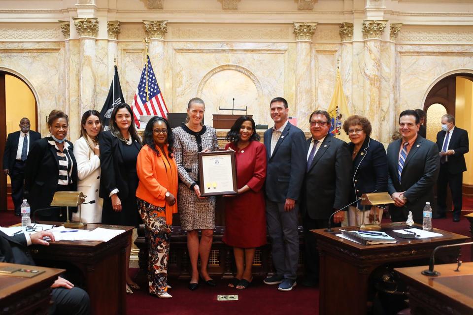 TESU President Merodie A. Hancock, PhD, accepts the resolution from Sen. Shirley Turner, Asw Verlina Reynolds-Jackson, Assemblyman Anthony S. Verelli, Sen. Teresa Ruiz., Sen. Sandra B. Cunningham, and Senate President Nicholas P. Scutari. Joining Hancock are graduate and former student trustee Apryl Roach (MBA, 2019), and TESU representatives Steven Albano and Marcela Maziarz.