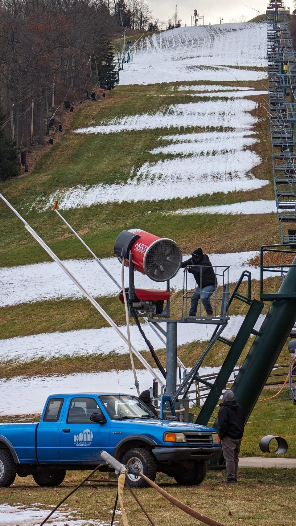 Workers adjust snowmaking equipment at Roundtop Mountain Resort in Warrington Township Monday November 27, 2023. Snowmaking was scheduled to resume around 10 p.m.