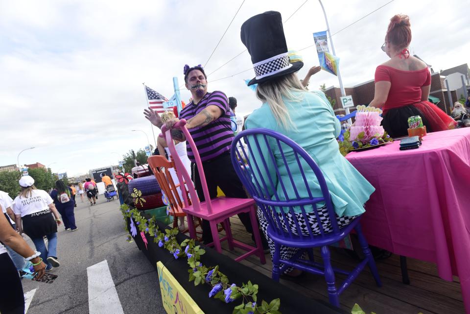Members of the Blue Water Recovery and Outreach Center dress as characters from the popular children's book "Alive in Wonderland" during the annual Rotary International Day Parade to kick off Port Huron's Boat Week on Wednesday, July 13, 2022.