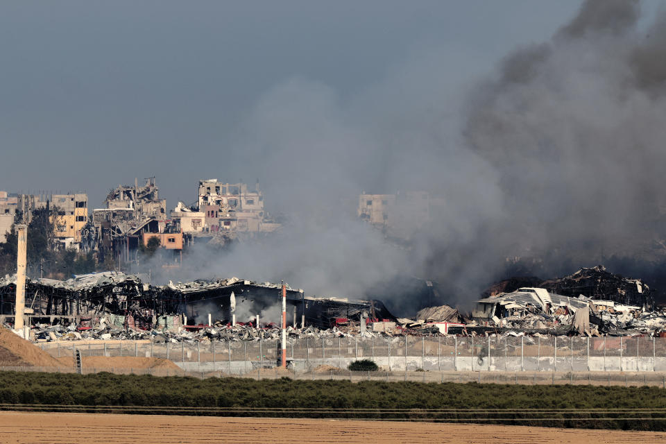 A picture taken in southern Israel near the border with the Gaza Strip on December 17, 2023, shows destruction and smoke in the north of the Palestinian territory resulting from weeks of Israeli bombardment amid ongoing battles with the Palestinian Hamas militant group. (Photo by JACK GUEZ / AFP) (Photo by JACK GUEZ/AFP via Getty Images)