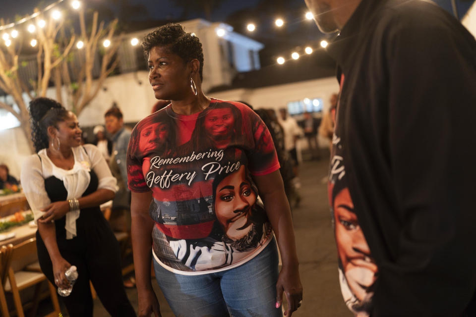 Jeffrey Price, right, and Yolanda Price, wearing T-shirts honoring Price Jr., attend a welcome dinner for the annual Families United 4 Justice Network Conference in the Studio City neighborhood of Los Angeles, Thursday, Sept. 28, 2023. Price Jr. was killed in a 2018 crash involving a police vehicle. The event was hosted by the Black Lives Matter Global Network Foundation at its mansion. (AP Photo/Jae C. Hong)