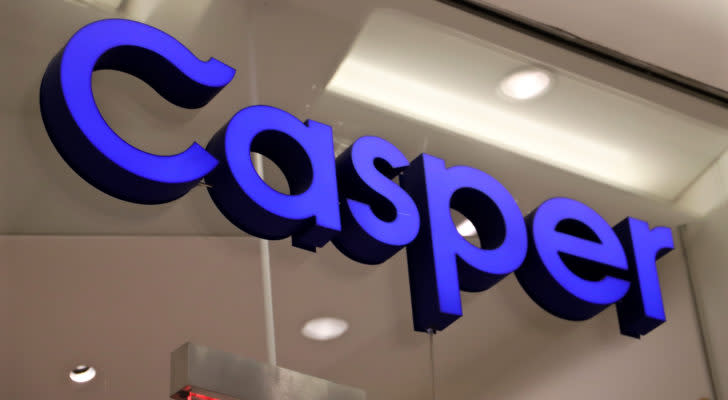 A bright purple sign for Casper Sleep (CSPR) hanging on a glass wall. 