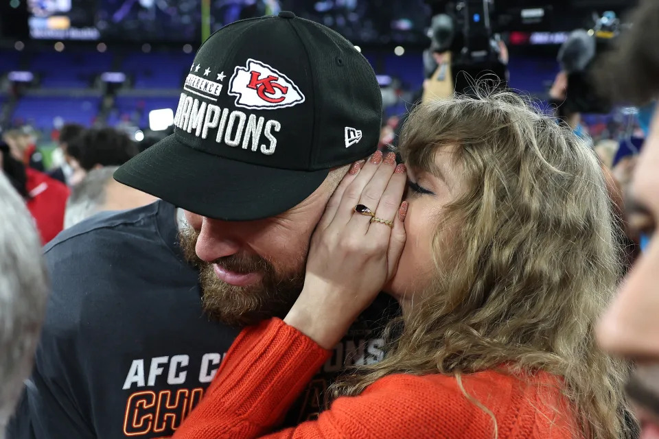 BALTIMORE, MARYLAND - JANUARY 28: Travis Kelce #87 of the Kansas City Chiefs celebrates with Taylor Swift after a 17-10 victory against the Baltimore Ravens in the AFC Championship Game at M&T Bank Stadium on January 28, 2024 in Baltimore, Maryland. (Photo by Patrick Smith/Getty Images)