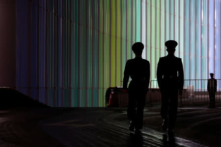 Security guards keep watch at the National Exhibition and Convention Center, the venue for the upcoming China International Import Expo (CIIE), in Shanghai, China November 3, 2018. REUTERS/Aly Song