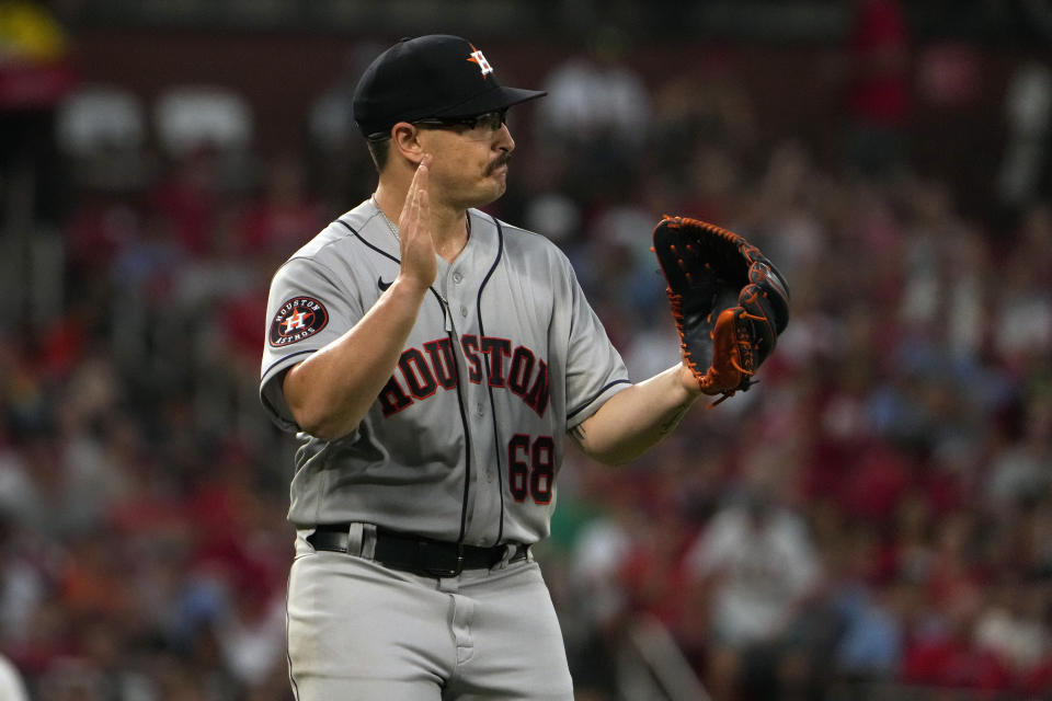 Houston Astros starting pitcher J.P. France applauds after getting St. Louis Cardinals' Nolan Gorman to ground out, ending the seventh inning of a baseball game Thursday, June 29, 2023, in St. Louis. (AP Photo/Jeff Roberson)