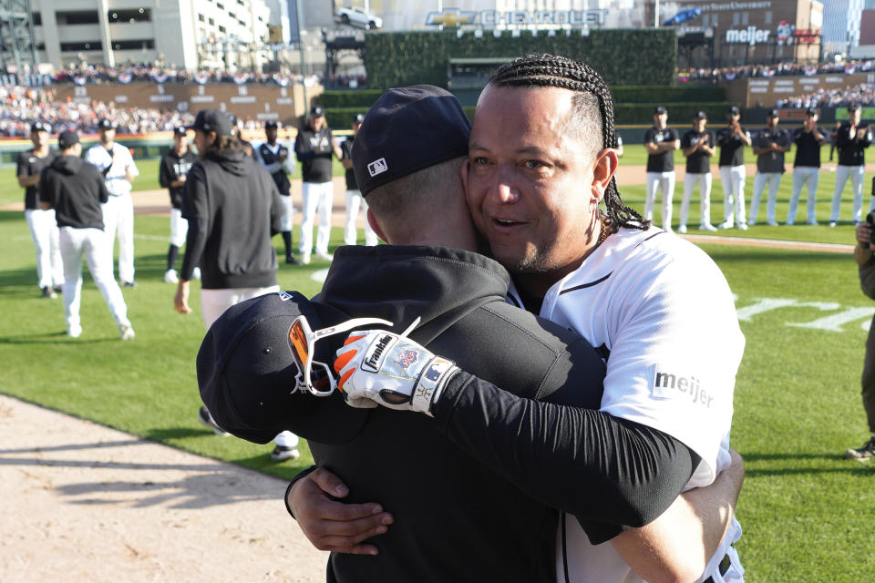 Detroit Tigers' Miguel Cabrera hugs teammates after being taken out of the game against the Cleveland Guardians in the eighth inning of a baseball game, Sunday, Oct. 1, 2023, in Detroit. Cabrera will retire after the game. (AP Photo/Paul Sancya)