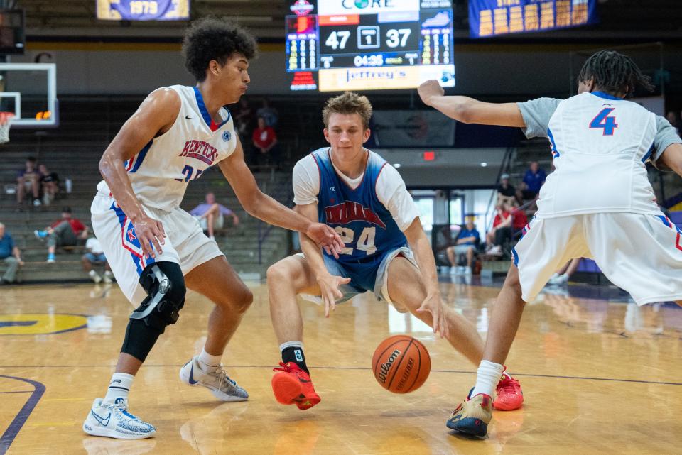 Indiana Junior All-Star Julius Gizzi (24) makes his way around Kentucky junior All-Stars defenders during their game on Sunday, June 2, 2024 in Scottsburg, Ind. at Charles E. Meyer Gymnasium for the first game of the Indiana vs Kentucky All-Stars basketball week.