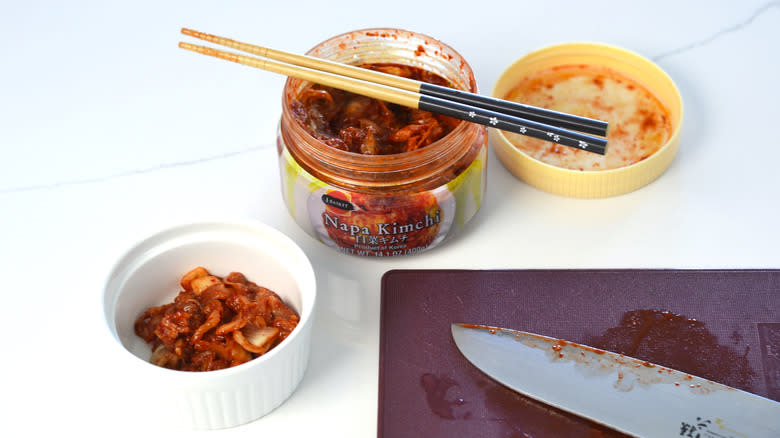 Jar of kimchi and a ramekin of chopped kimchi