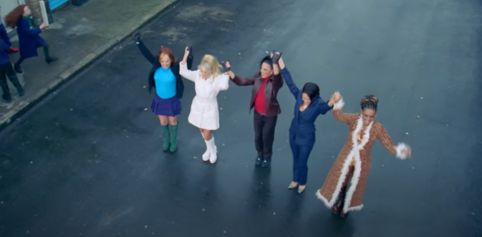 The Spice Girls can be seen stood in the middle of a street in a line in the new clip (YouTube)