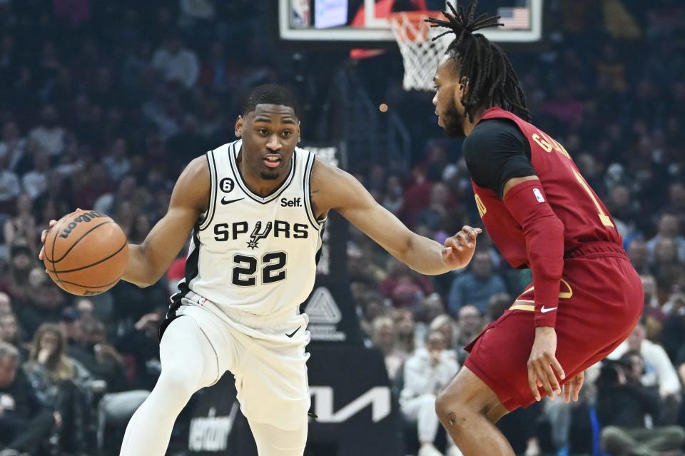 San Antonio Spurs guard Malaki Branham drives to the basket against Cavaliers guard Darius Garland during the first half, Monday, Feb. 13, 2023, in Cleveland.