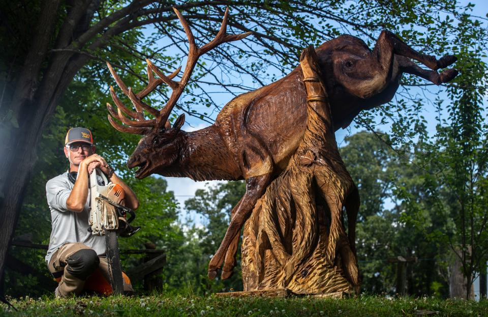 World-class chainsaw artist Abby Peterson makes a living sculpting art out of wood. Peterson lives in Webster, Ky. July 5, 2022