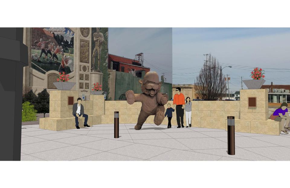 An artist's rendering shows the bronze Obie statue at Lincoln Way East and First Street NE. A sandstone wall with benches will serve as a backdrop to the 8-foot statue and obscure a parking lot behind it.