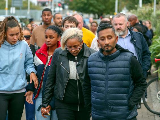 Family and friends of stabbing victim Tashan Daniel, 20, arrive for a vigil outside Hillingdon Tube station in west London, 26 September 2019. (Steve Parsons/PA Wire)