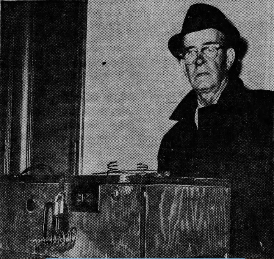 Rainmaker John A. Miller poses with his black plywood box. The Gazette and Daily gave this description of this machine that Miller claimed sent out 16,000-volt electronic waves that buffeted clouds: “Twisted coat hangar wire; copper tubing; a rocking chair spring – all of it mounted on the outside of a plywood box measuring about 30 inches long, 14 inches wide and 10 inches deep.