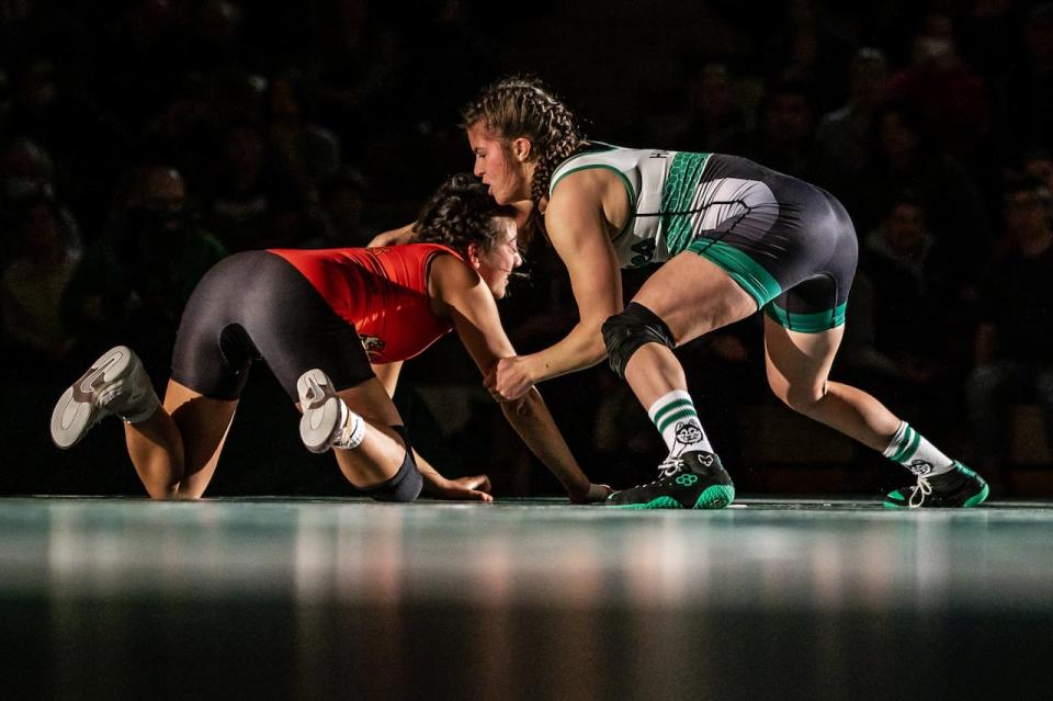 SueAnne Harms, right, of the Saskatchewan Huskies women's wrestling team is the reigning 53-kilogram champion at the U Sports wrestling championships, and is looking to repeat her gold-medal performance this March in Guelph, Ont. (Derek Elvin/Electric Umbrella/File - image credit)
