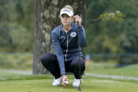 Nelly Korda sets up her shot on the fourth green in the first round of the Cognizant Founders Cup LPGA golf tournament, Thursday, Oct. 7, 2021, in West Caldwell, N.J. (AP Photo/John Minchillo)