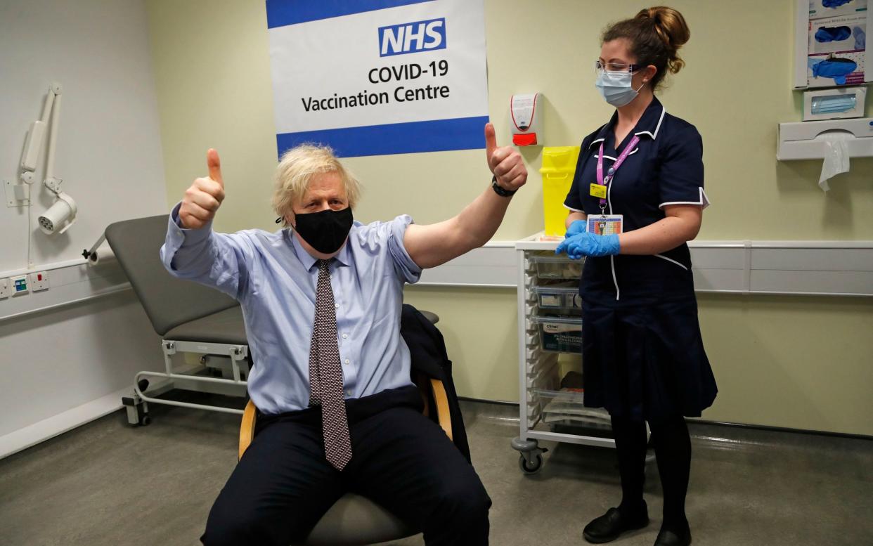 Boris Johnson shows his delight after receiving his first dose of the AstraZeneca jab at St Thomas's Hospital, in central London, on Friday -  Frank Augstein/PA