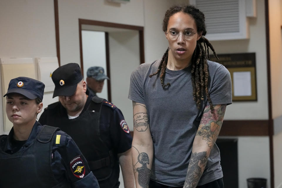 Brittney Griner is escorted from a courtroom