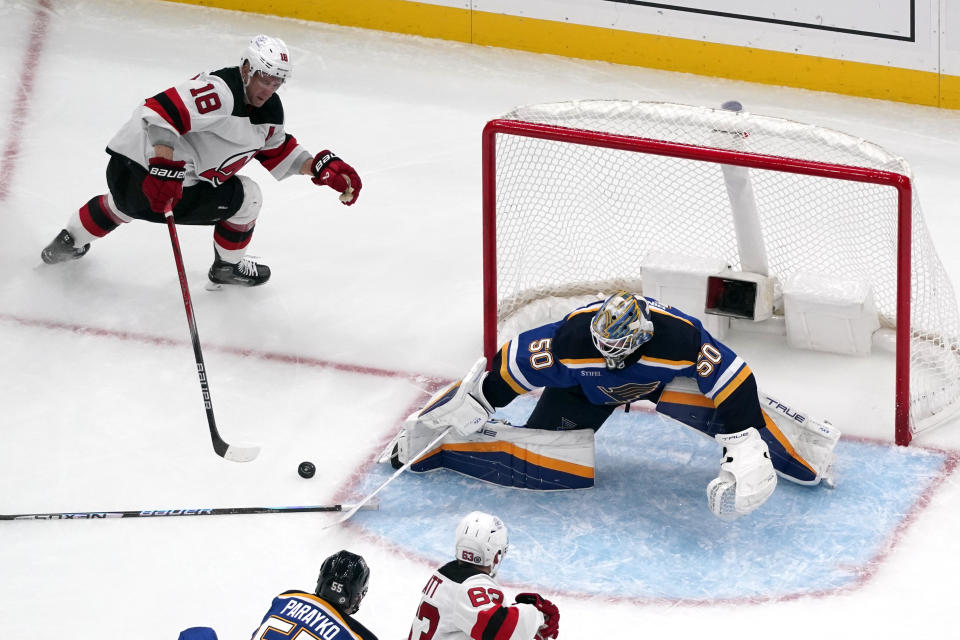 New Jersey Devils' Ondrej Palat (18) is unable to score past St. Louis Blues goaltender Jordan Binnington (50) during the second period of an NHL hockey game Friday, Nov. 3, 2023, in St. Louis. (AP Photo/Jeff Roberson)