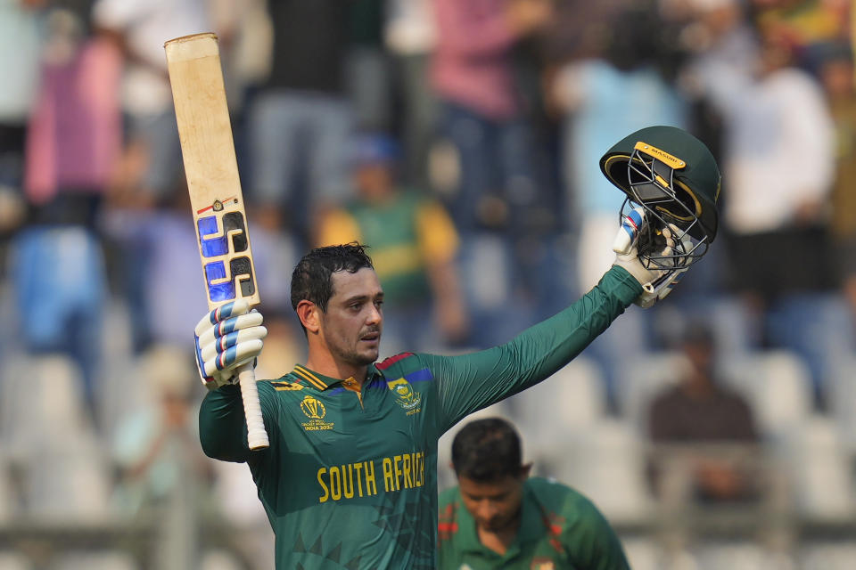 South Africa's Quinton De Kock celebrates his century during the ICC Men's Cricket World Cup match between Bangladesh and South Africa in Mumbai, India, Tuesday, Oct. 24, 2023. (AP Photo/Rajanish Kakade)