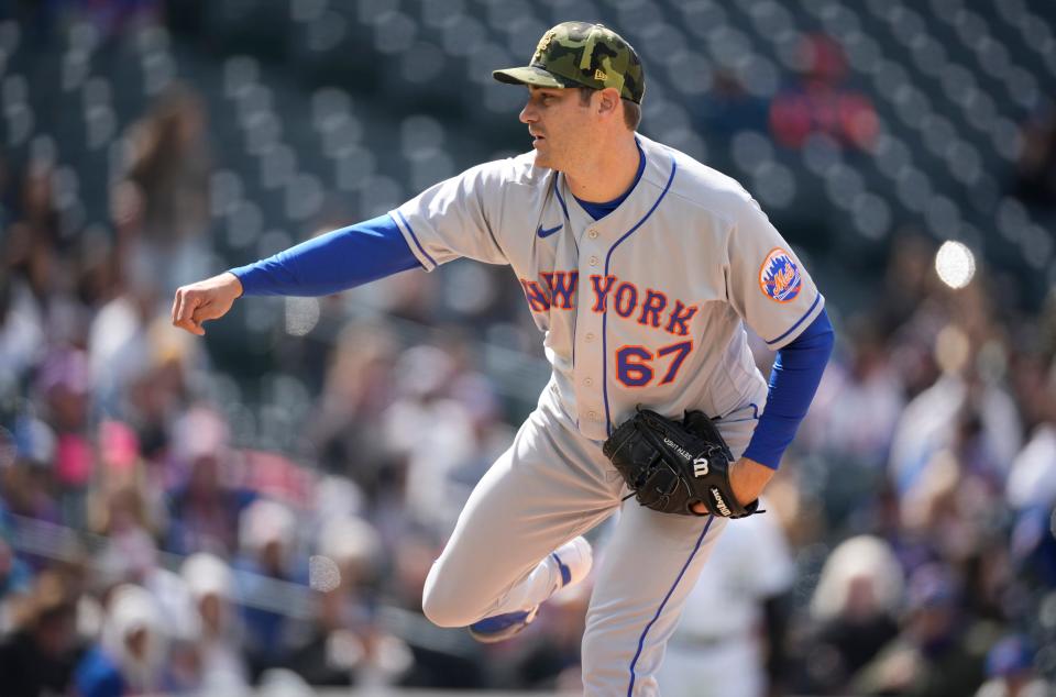 New York Mets relief pitcher Seth Lugo works against the Colorado Rockies in the eighth inning of the first baseball game of a doubleheader Saturday, May 21 2022, in Denver.