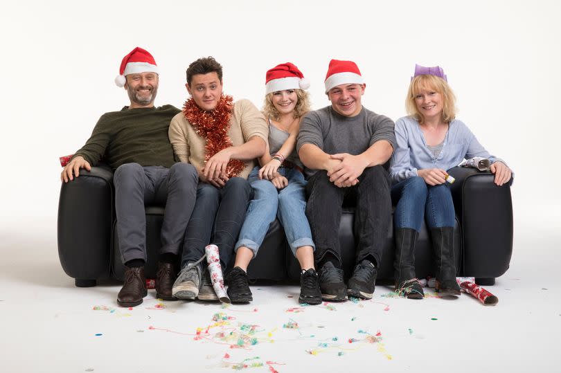 Family sitting on a sofa