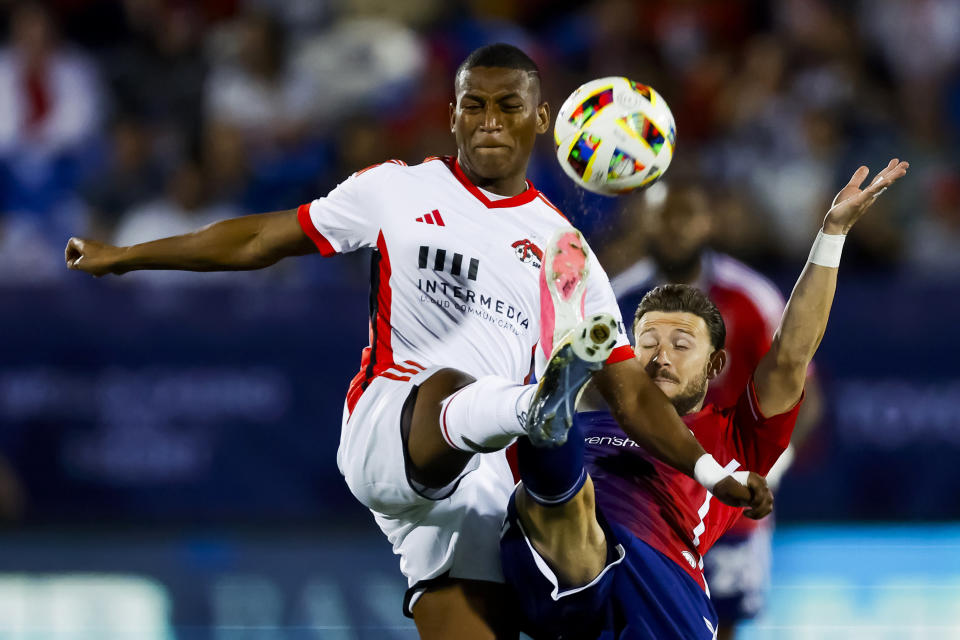 San Jose Earthquakes midfielder Carlos Gruezo, left, and FC Dallas forward Paul Arriola, right, vie for the ball during the first half of an MLS soccer match Saturday, Feb. 24, 2024, in Frisco, Texas. (AP Photo/Brandon Wade)