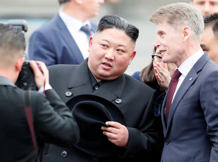 North Korean leader Kim Jong Un speaks with Governor of Primorsky Region Oleg Kozhemyako as he arrives at the railway station in the Russian far-eastern city of Vladivostok, Russia, April 24, 2019. REUTERS/Shamil Zhumatov