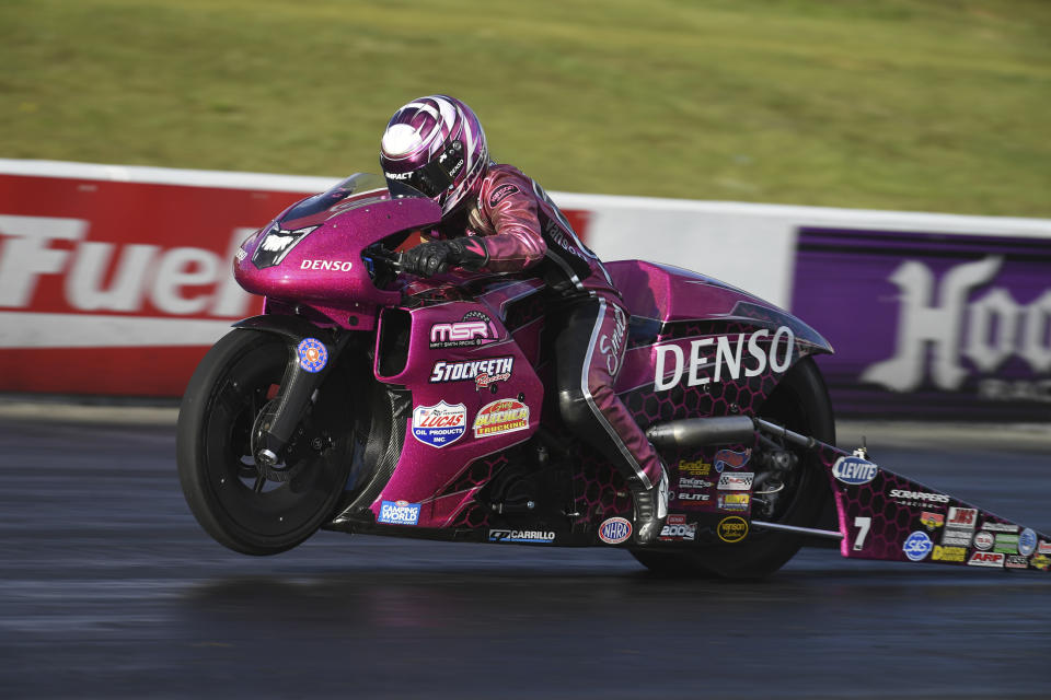 In this photo provided by the NHRA, Angie Smith drives in Pro Stock Motorcycle qualifying in the Virginia NHRA National drag races at Virginia Motorsports Park on Friday, May 13, 2022, in Dinwiddie, Va. (Auto Imagery/NHRA via AP)