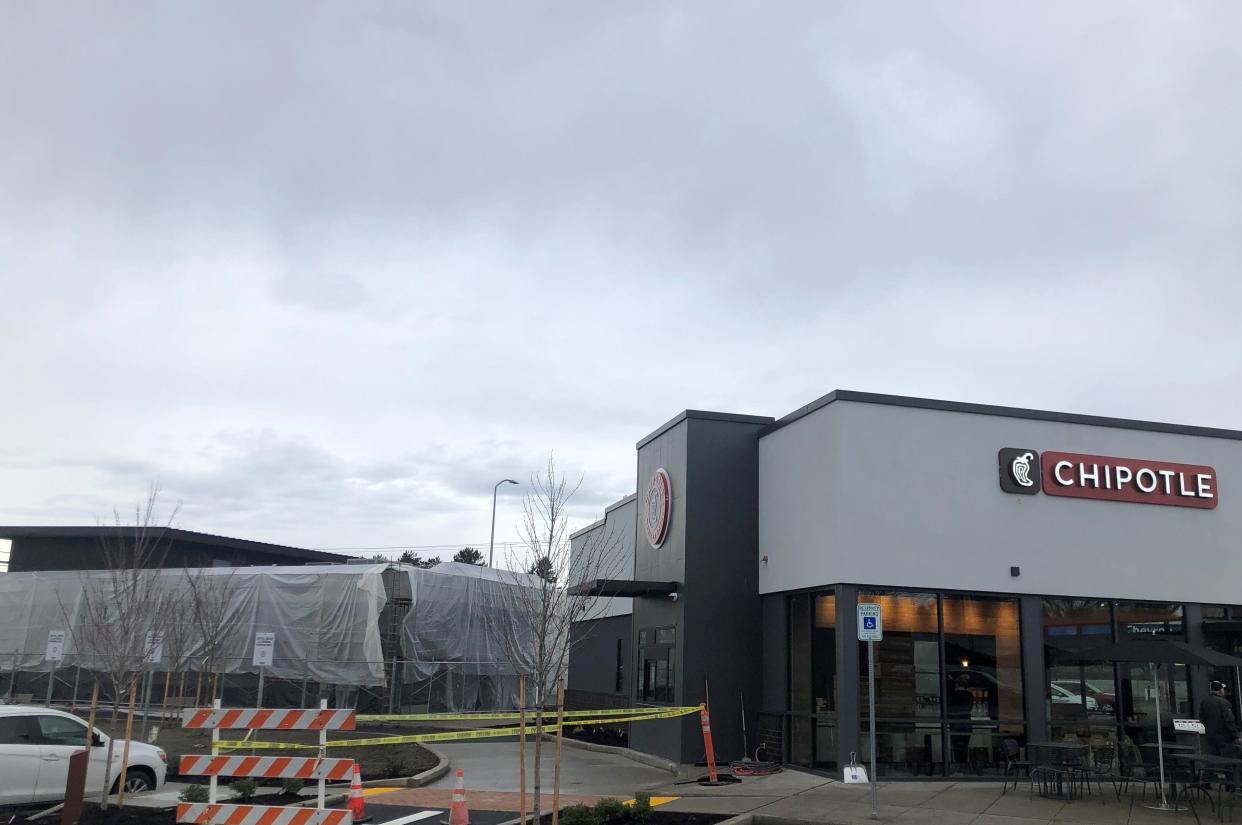 A new Chipotle Mexican Grill, at right, with an under-construction MOD Pizza franchise at left, will open in the Bremerton Station plaza along Wheaton Way at Riddell Road on Sunday, Dec. 31.